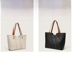 Detailed comparison of grey and black large tote bags with brown leather handles