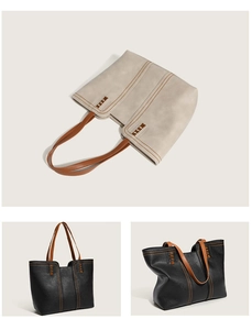 Detail of faux leather tote bag showing contrast stitching and woven handle accents