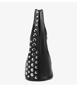 Detail view of large silver studs on black matte leather motorcycle tote bag side