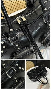Detail of silver rivets and crinkled glossy leather on a black motorcycle tote bag