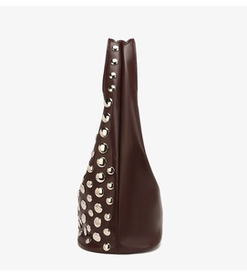 Side view of dark brown tote bag featuring silver studs and a triangular silhouette