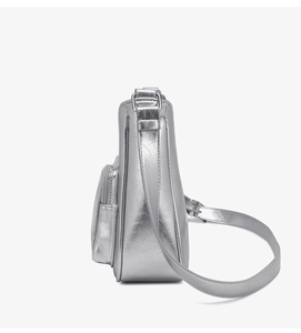 Detail view of metallic silver crossbody bag featuring side zipper pocket and PU leather texture