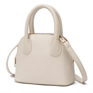 Minimalist cream white shell-shaped tote bag with litchi grain leather and gold hardware