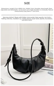 Detailed view of black pleated croissant hobo bag size 27x3x13cm with adjustable strap