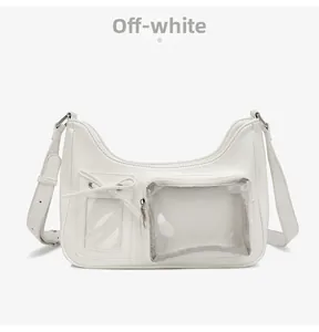 Detail of off-white PU leather crossbody bag with a clear window and bow decoration