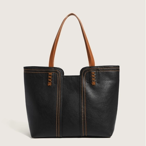 Classic black tote bag with brown straps and contrast stitching for work use