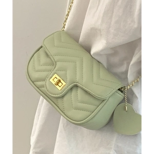 Chic mint green quilted chain bag with V-shaped stitching and gold heart charm