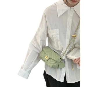 Mint green chevron quilted crossbody bag with gold chain strap and heart charm
