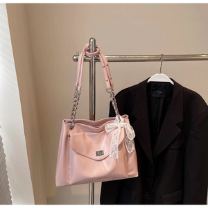 Pink large capacity faux leather tote bag with silver chain strap and lace bow accent