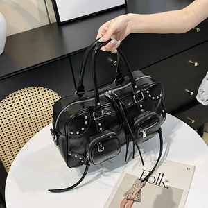 Fashionable black glossy leather tote bag with silver studs and multi-zipper pockets