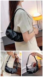 Detail view of black croissant hobo bag featuring ruched texture and fashion lettering