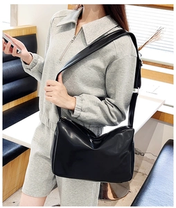 Macro detail of high-quality black PU leather texture and silver smooth metal zipper