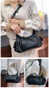 Detail of a black multi-pocket retro crossbody bag showing side and back views