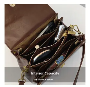 Detail showing multiple inner compartments and large storage capacity of the brown bag