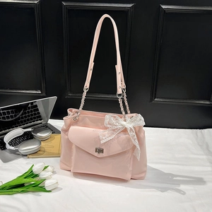 Sac cabas rose brillant avec nœud en dentelle blanche et fermoir rotatif argenté