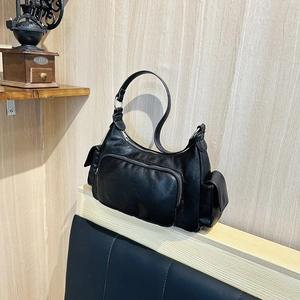 Retro black leather shoulder bag with multi-pocket design and silver hardware
