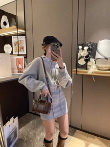 Mirror selfie of a grey two-piece lounge set with cropped hoodie and drawstring skirt