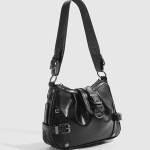 Modern black faux leather underarm bag with metallic accents and stylish shoulder strap