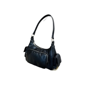 Retro black faux leather shoulder bag with side pockets and silver metal rings
