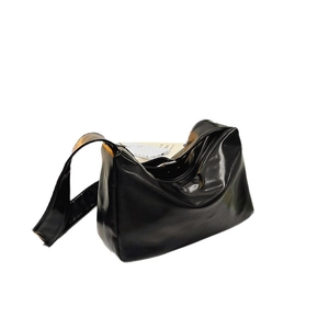 Glossy black minimalist tote bag with smooth shoulder strap and spacious interior