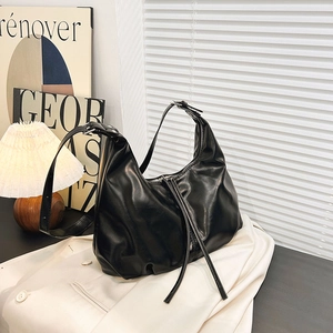 Minimalist black large capacity hobo shoulder bag with textured leather and zipper