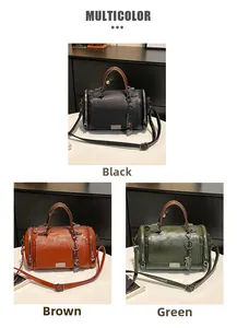 Dettaglio borsa Boston da donna in nero, marrone e verde con tracolle regolabili