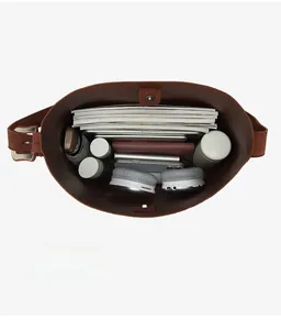Vertical top view showing large capacity interior with tablet, umbrella and accessories