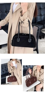 Detail of contrast stitching and suede texture on black and brown tote bags
