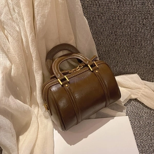 Vintage brown glossy leather Boston handbag with gold zipper and dual top handles