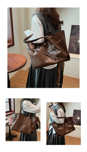 Detail view of large brown faux leather tote bag with gold metallic buckle and strap