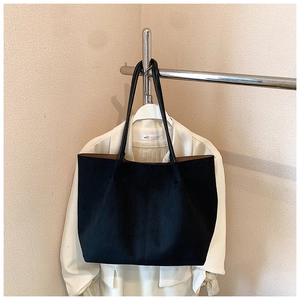 Minimalist black oversized tote bag in faux suede, perfect for stylish daily commuting