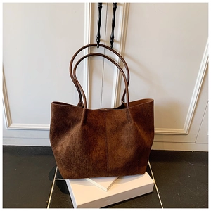 Brown faux suede large capacity tote bag with long handles and minimalist vertical stitching