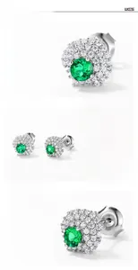 Macro shot of S925 sterling silver emerald earrings with halo diamond settings
