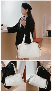 Detail of white large capacity PU leather tote bag showing fine grain and drawstring design