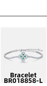 Detail of silver clover bracelet with green pear-cut stones and adjustable chain
