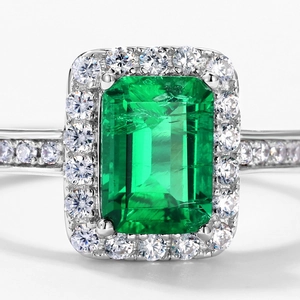 Vintage S925 silver halo ring featuring emerald-cut green gemstone with diamond accents