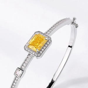 Luxurious S925 silver bangle with radiant rectangular yellow gemstone and pave diamonds
