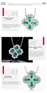 Macro detail of S925 silver clover necklace featuring heart-cut green lab emeralds
