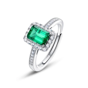 Vintage S925 silver ring with emerald cut green gemstone and pavé halo setting