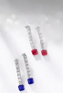 Detail of S925 silver long drop earrings with square red and blue lab rubies and sapphires