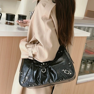 Retro black leather tote bag with silver rivets and buckle in motorcycle style