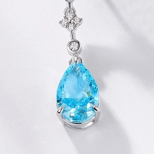 Elegant S925 silver earrings featuring pear-cut light blue gemstones and diamond accents