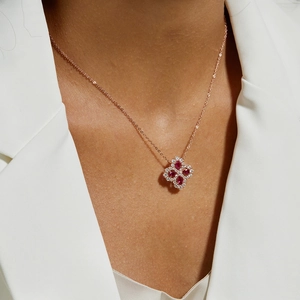 Elegant rose gold S925 silver necklace with red flower clover pendant on model