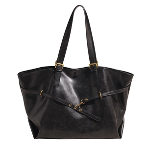 Classic black leather tote bag with gold hardware and shoulder straps for daily commute