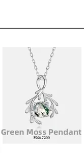Detailed view of moss agate pendant with silver leafy design on a fine chain
