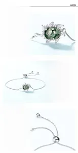 Detailed macro of S925 silver bracelet featuring moss agate and hand-set cubic zirconia