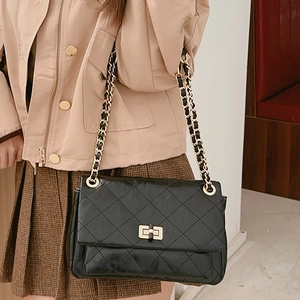 Classic black quilted leather crossbody chain bag for women with gold clasp finish