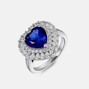Luxurious heart-shaped blue sapphire ring with a double halo of sparkling diamonds