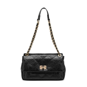 Classic black quilted leather shoulder bag with golden chain strap and turn-lock closure