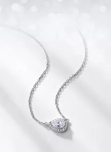 Macro shot of S925 silver pear-cut moissanite pendant with elegant prong-set detail